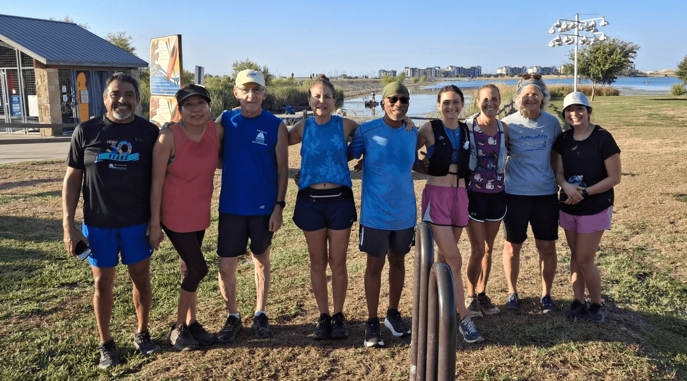 Pflugerville Running Club members gathered at Lake Pflugerville after a Saturday run